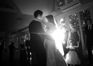 Bride and groom dancing at an elegant Fairfield wedding reception with DJ lighting